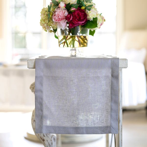 Hemstitch Linen Table Runner - 17" Wide - Sale, displayed on a table with a floral patterned napkin visible.
