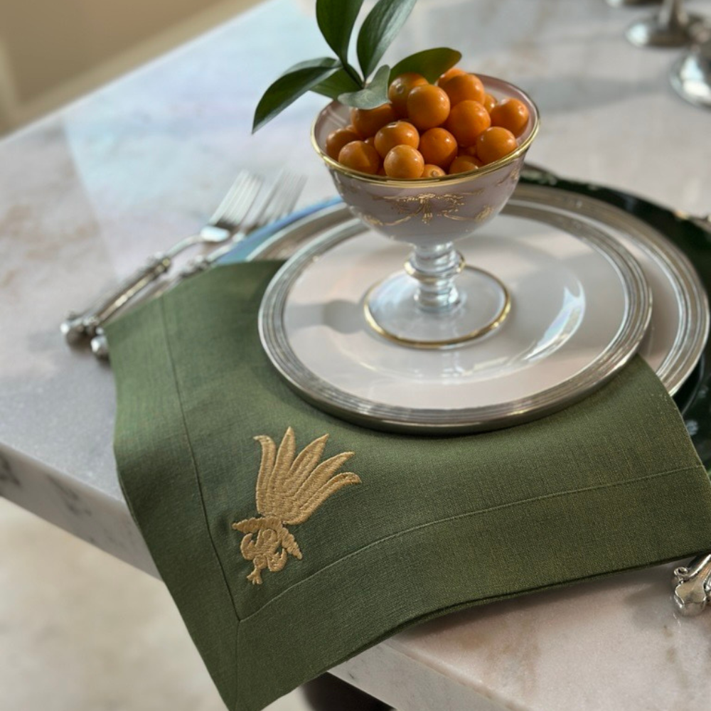 Evergreen 100% Linen napkin embroidered with Gold Villa Floret Design on Tuscan Dinnerware.
