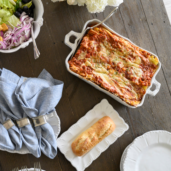 arte-italica-bella-bianca-rectangular-lasagna-dish-stoneware full table ready to serve