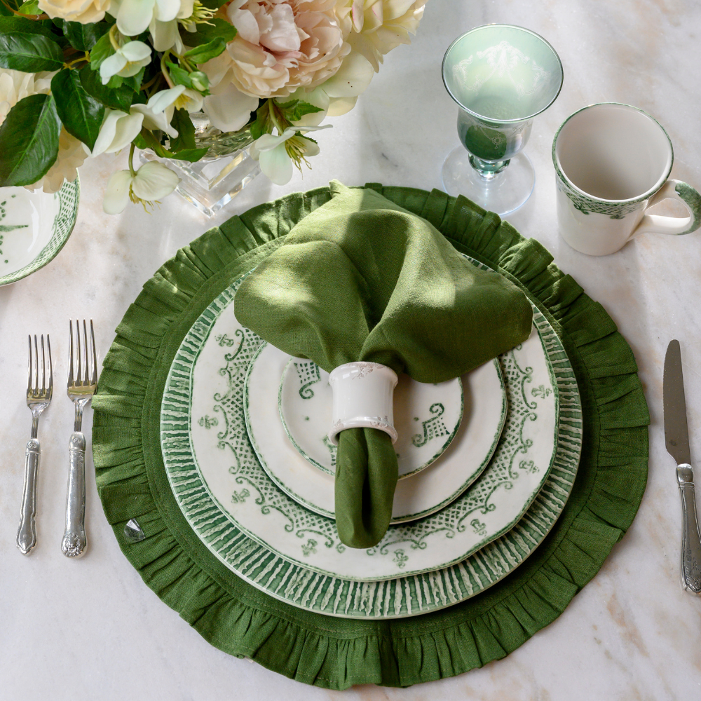 Arte Italica Burano dinner plate green ceramic Italian hand painted dinnerware, decorative table plate with green napkini and green linen placemat