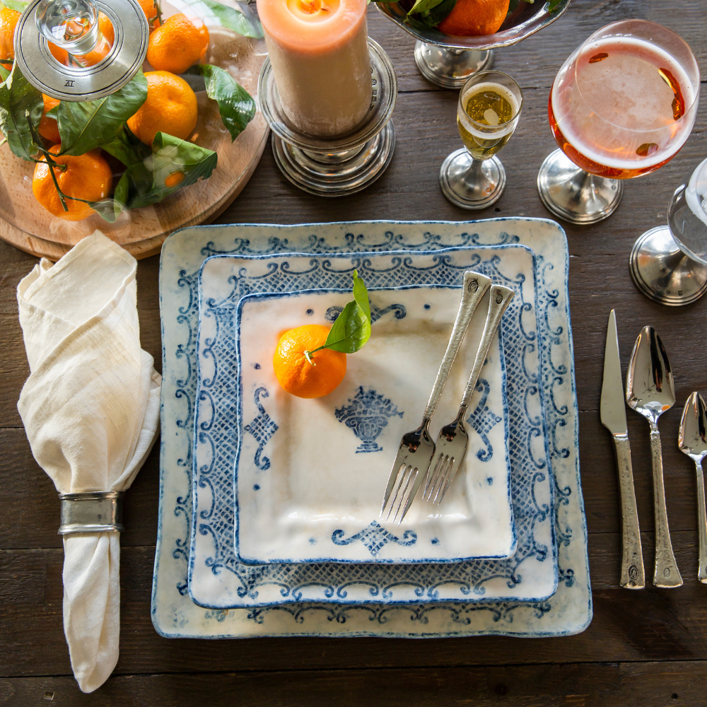 arteitalica-burano-large-square charger blue ceramic Italian hand painted dinnerware, serving platter ovehead view on table with oranges