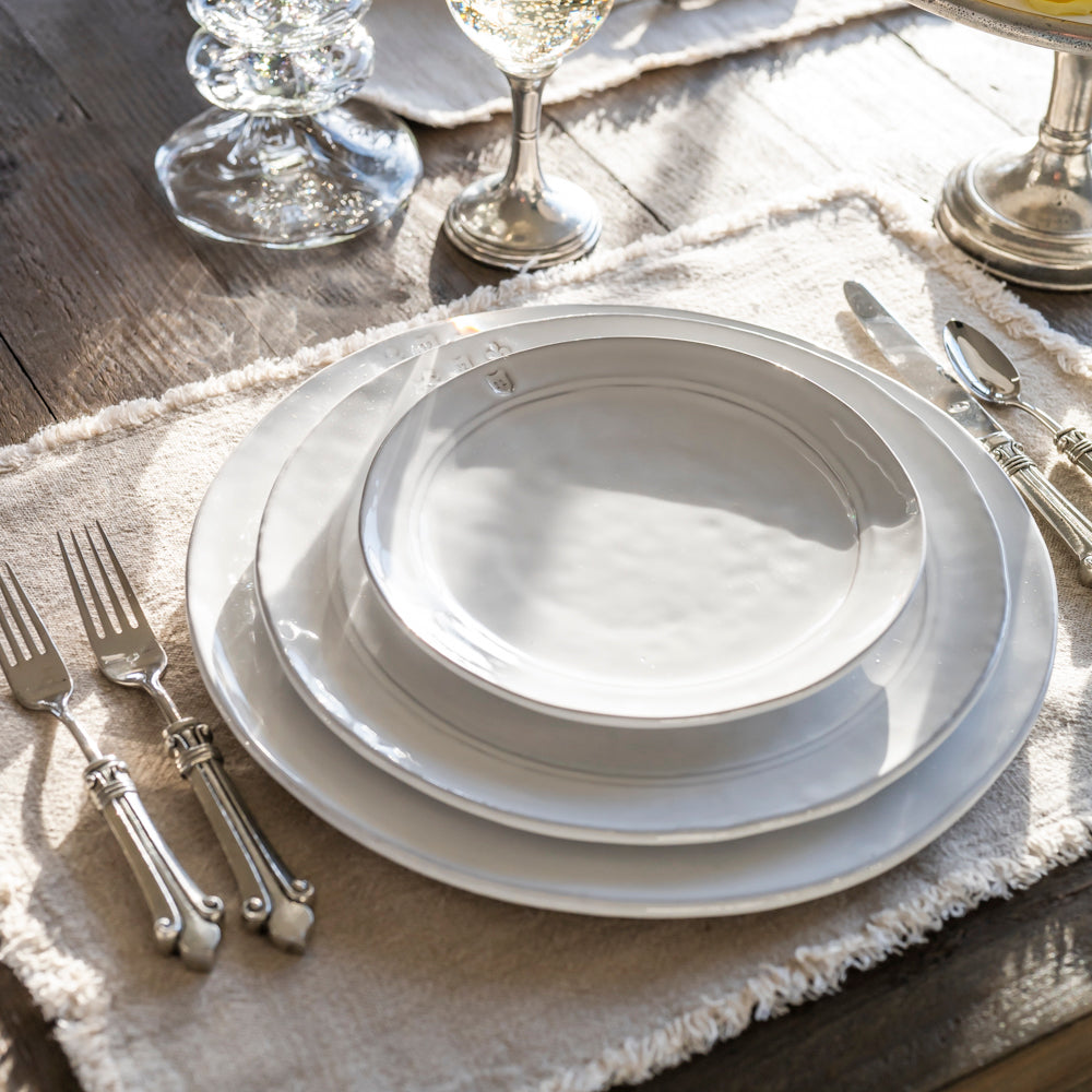 Firenze Charger white Italian stoneware dinner charger plate for elegant tables viewed here on table stack with dinner and salad plate