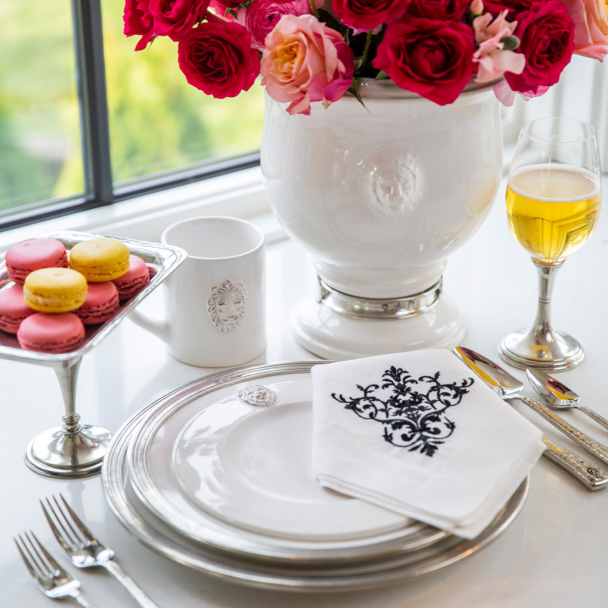 Arte Italica Renaissance Leone Mug White Handmade Italian Ceramic Lion Inspired Coffee Tea Mug on counter with place setting