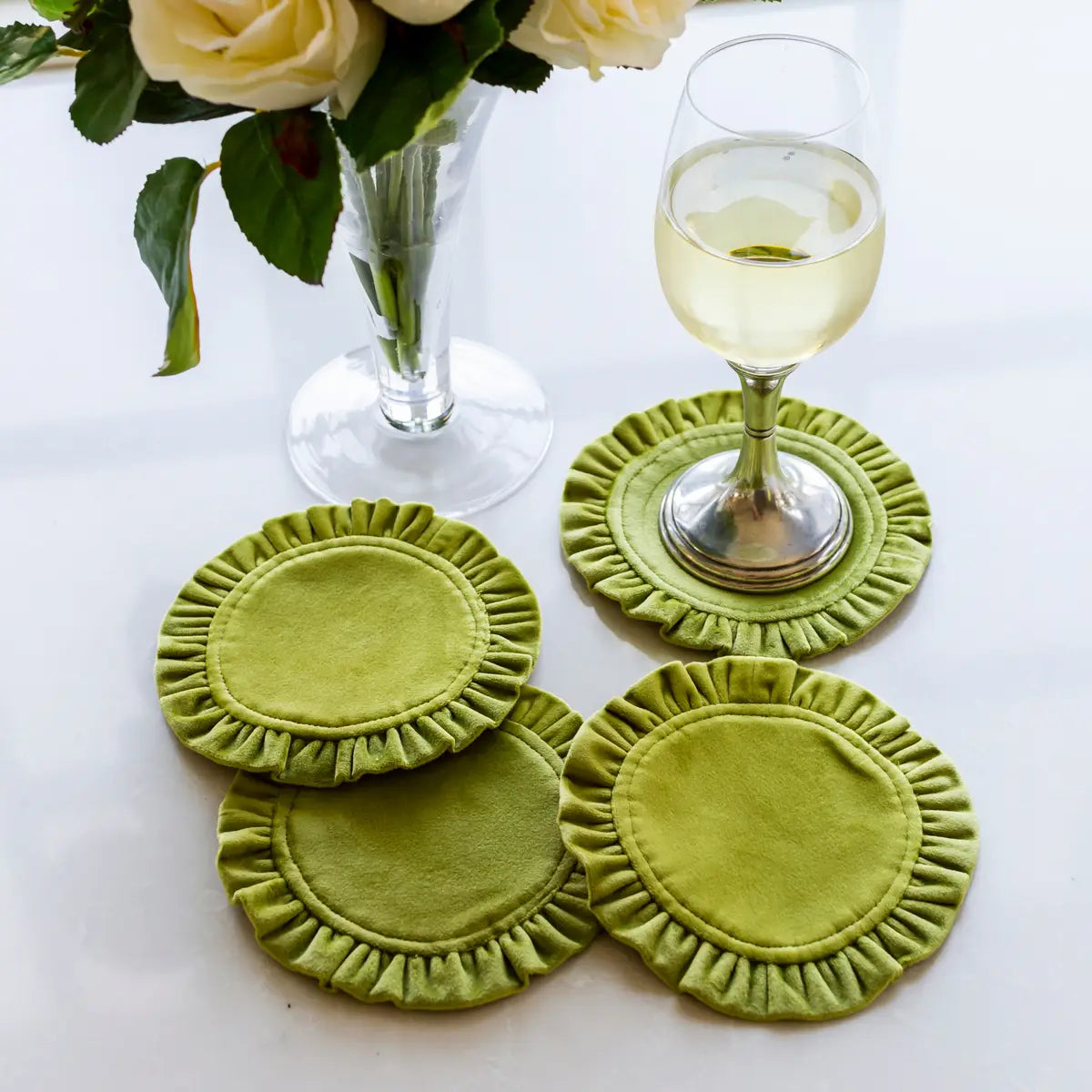 Round Ruffle Velvet Coaster Set with a frilled edge displayed on a table, with one coaster slightly lifted to show the texture.