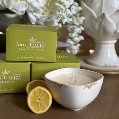 Scavo candle shown with green box and lemons. 