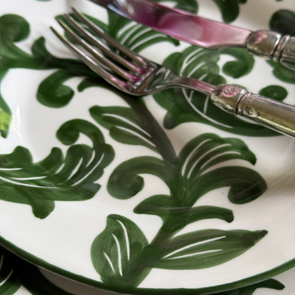 Detailed shot of hand-painted green design on Al Fresco plates. 