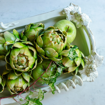 Looking down at the Antico Toscana ceramic rectangular dish filled with artichokes showing vine detail