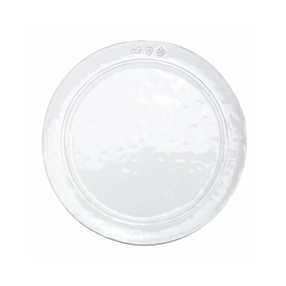 A white Firenze stoneware dinner plate with Italian Stamp designs embedded in the rim.