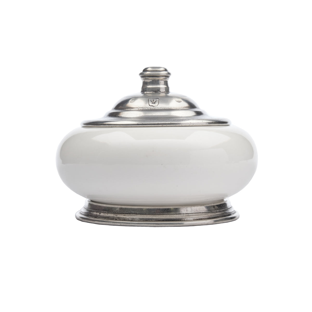A round Tuscan keepsake box with a white ceramic body and pewter lid, featuring a decorative pattern typical of the Tuscan style.