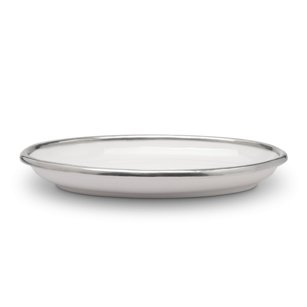 A Tuscan oval platter with a white ceramic body and pewter rim.
