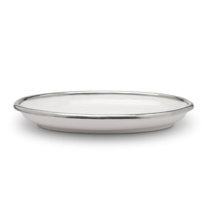 A Tuscan oval platter with a white ceramic body and pewter rim.