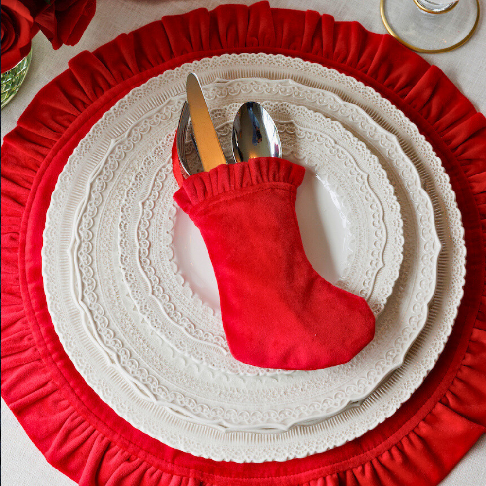 Arte Italica Finezza cream ceramic charger plate on red velvet placemat– elegant Italian dinnerware for timeless table settings