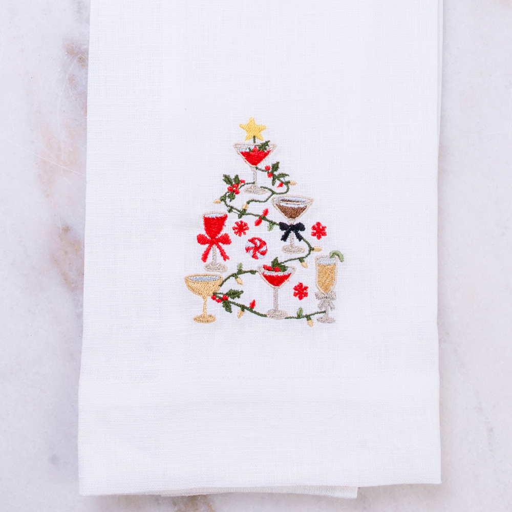 White Linen Christmas Cocktails design embroidered on a towel on a white background