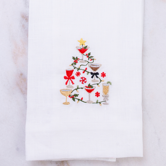 White Linen Christmas Cocktails design embroidered on a towel on a white background