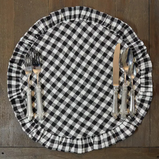 Ruffle placemat with black and white gingham patterns paired with pewter flatware. 