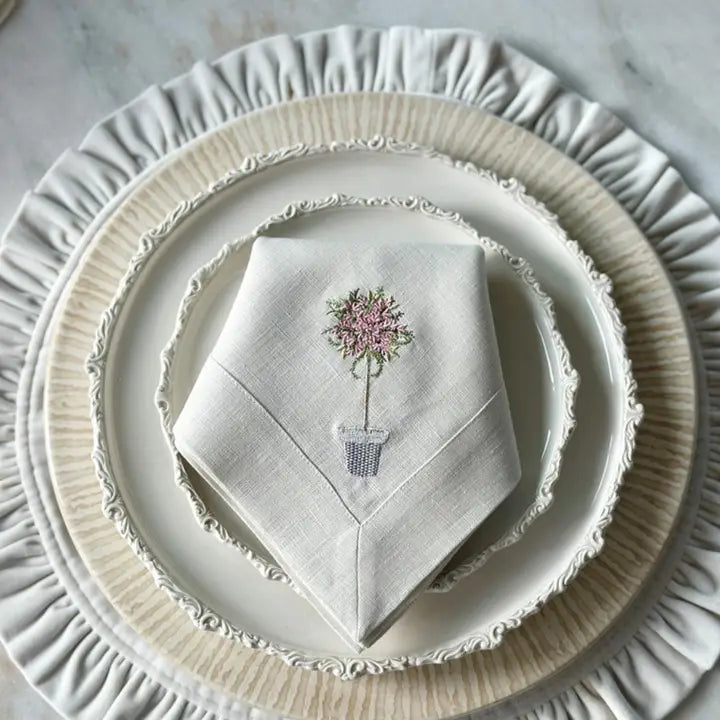 Stack of Plates on a Cream Velvet Charger with Napkin