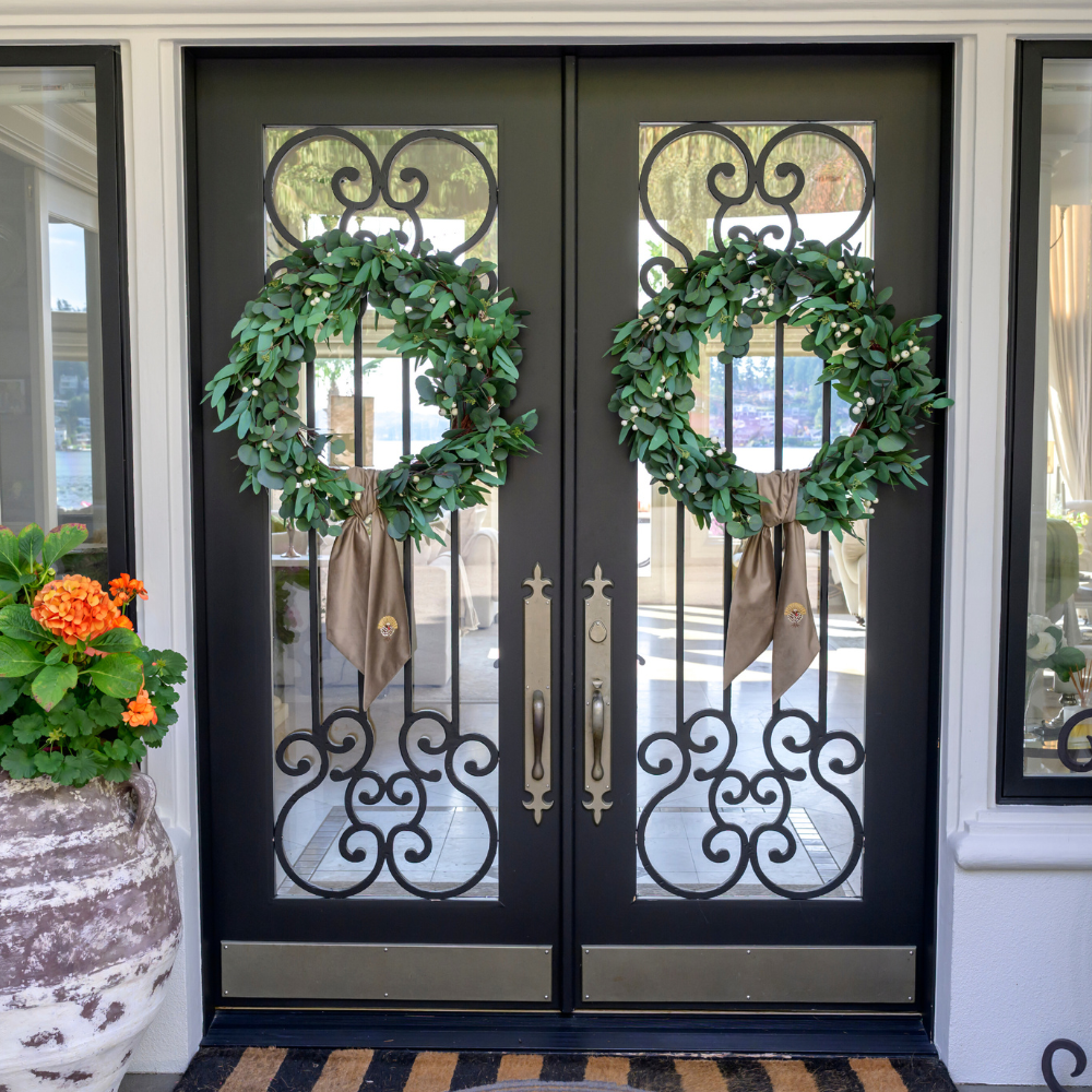 Decorative wreaths with Mocha Velvet embroidered Turkey bows on a double door entrance.