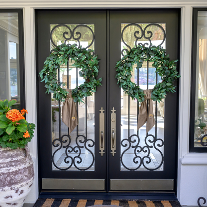 Decorative wreaths with Mocha Velvet embroidered Turkey bows on a double door entrance.