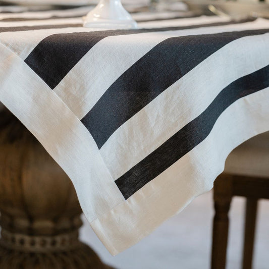 Black and white striped tablecloth on a table with blurred background