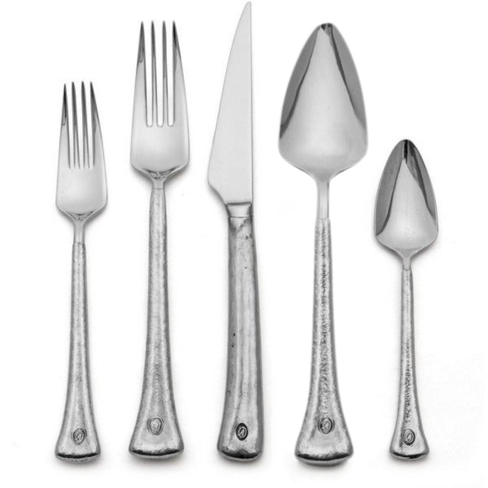 Elena Flatware Collection detail shot. Italian pewter is hand wrapped around 18/10 stainless steel to create our Elena Flatware. Features textured handles and triangular heads of utensils.