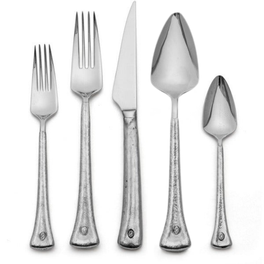 Elena Flatware Collection detail shot. Italian pewter is hand wrapped around 18/10 stainless steel to create our Elena Flatware. Features textured handles and triangular heads of utensils.