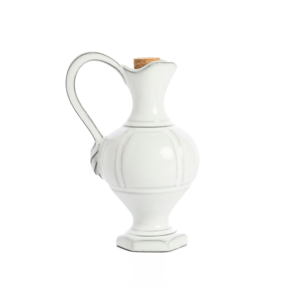 White ceramic Firenze Cruet pitcher with a cork lid on a white background