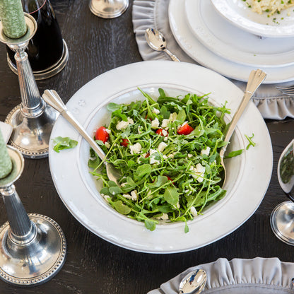White Firenze Stoneware Serving bowl with Green Salad on a table