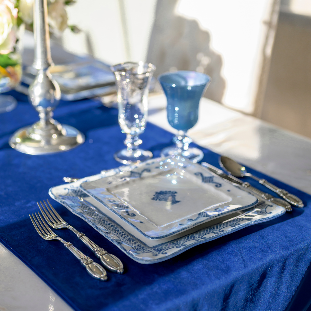 Detailed shot of Villa Veneto Flatware Collection styled with Blue Burano dinnerware.