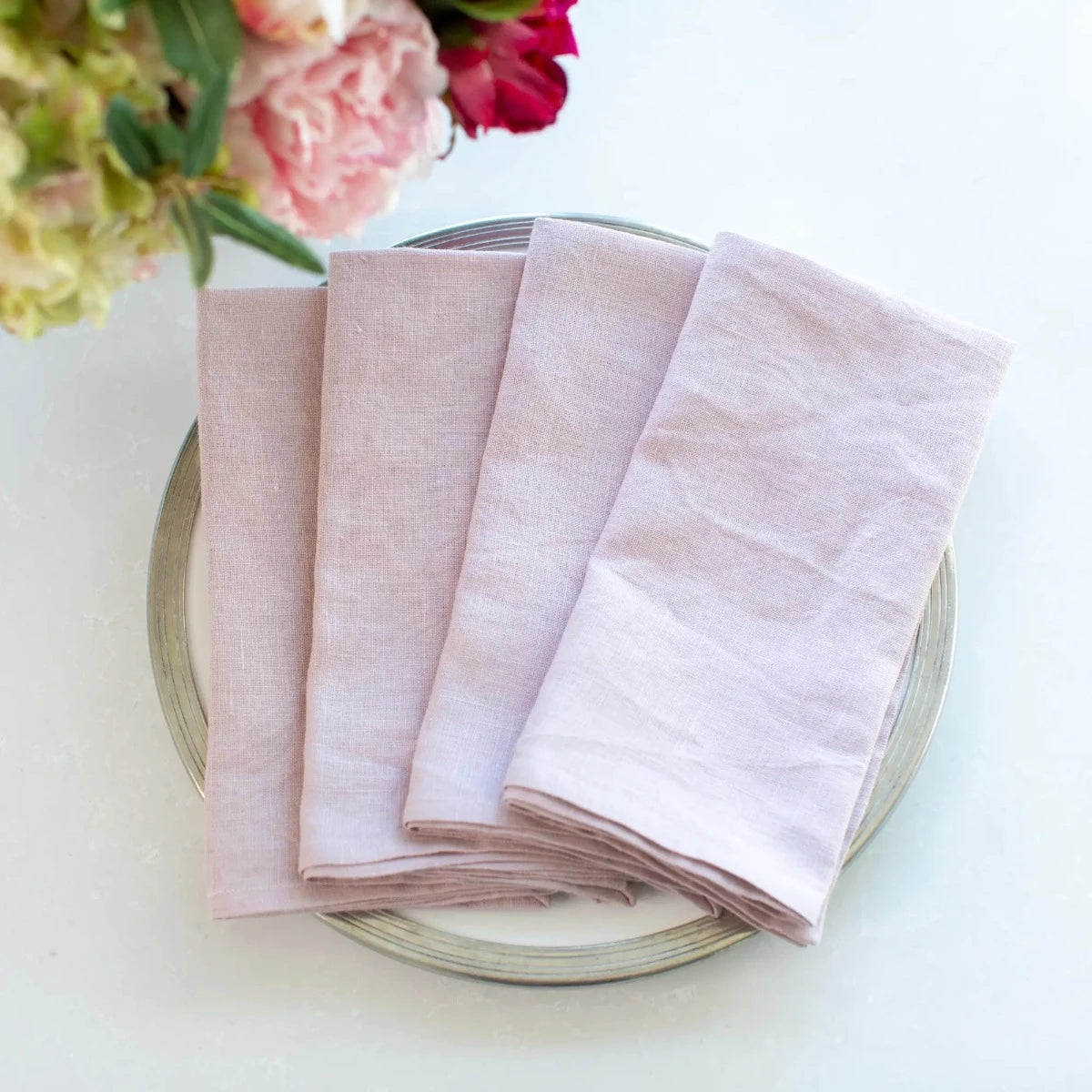 Washed Linen Napkin Set in Lilac displayed on a Tuscan Diner plate