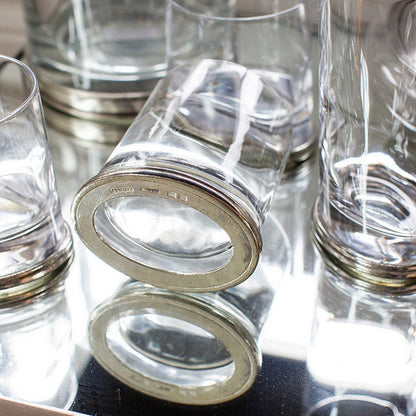 Close-up of oval Italian pewter bases on Arte Italica Milano Double Old Fashioned glasses, showing handcrafted detail and hallmark stamp