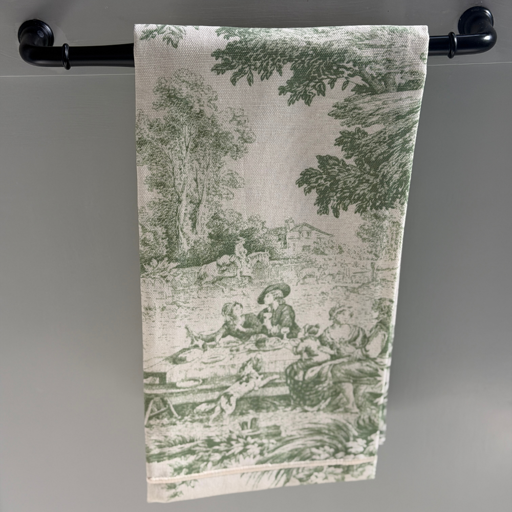 Cream with Green Montefalco toile cotton towel hanging on a bar