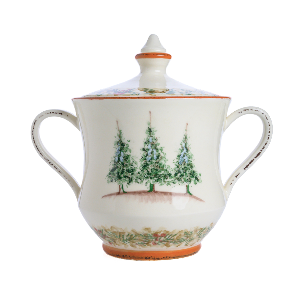 A two handled cookie jar with lid in the Arte Italica Natale pattern with 3 trees painted on it on a white background