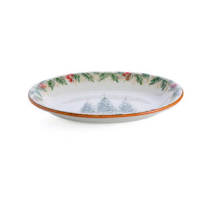 A small oval Natale hand painted ceramic platter with 3 trees in the center on a plain white background view from the side