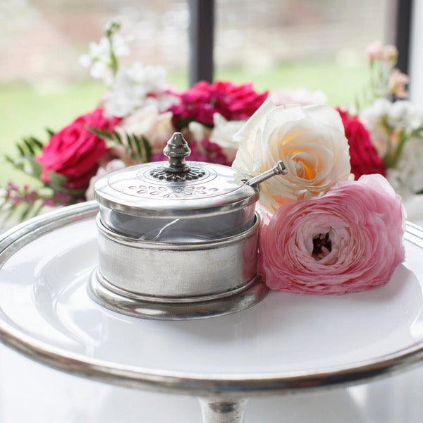 Peltro Condiment Dish with Spoon surrounded by pink and white flowers