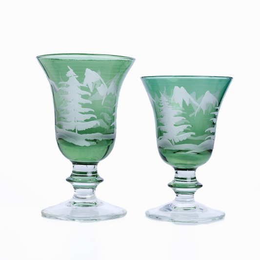 Rialto Winterscape green etched pine water/wine glass and wine glass on a plain white background
