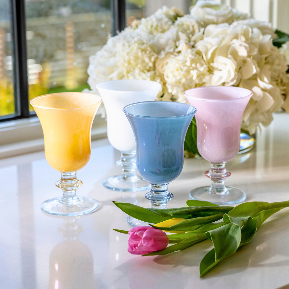 Rialto Italian Water Wine Glasses in Yellow, Pink, Blue and white on a counter with flowers - Arte Italica