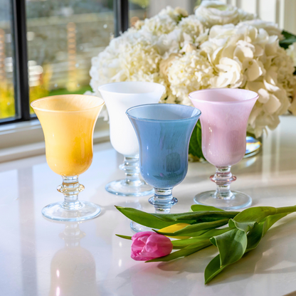 Rialto Italian Water Wine Glasses in Yellow, Pink, Blue and white on a counter with flowers - Arte Italica