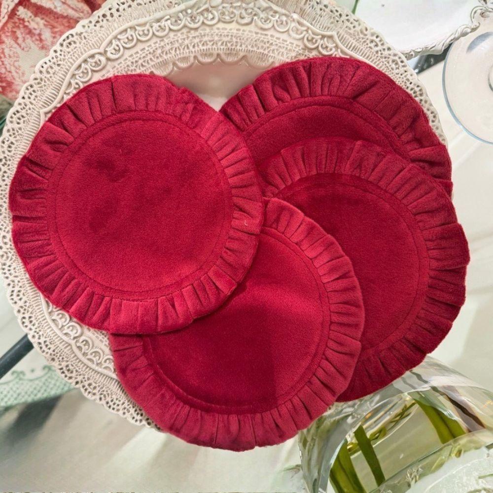 Round Ruffle Velvet Coaster Set in Garnet spread out on a Finezza Plate