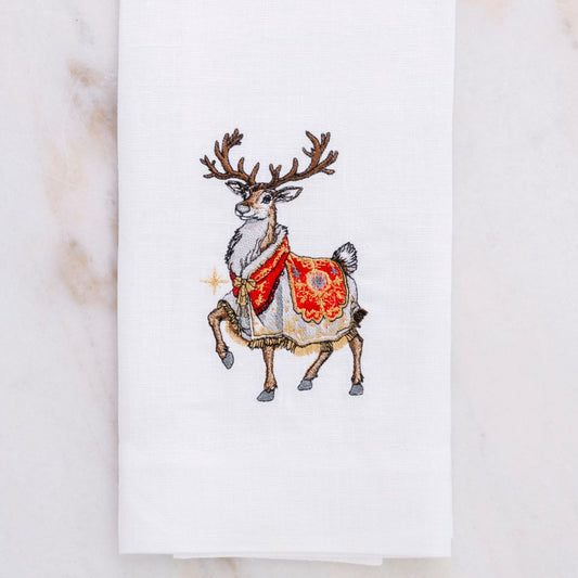 Embroidered reindeer with a red and gold pattern on a white Linen hand towel by Crown Linen Designs