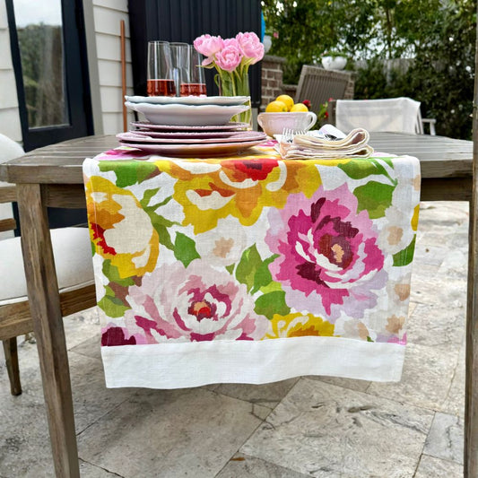 Arte Italica Portofino Summer Garden Linen Table Runner on a table outside on patio