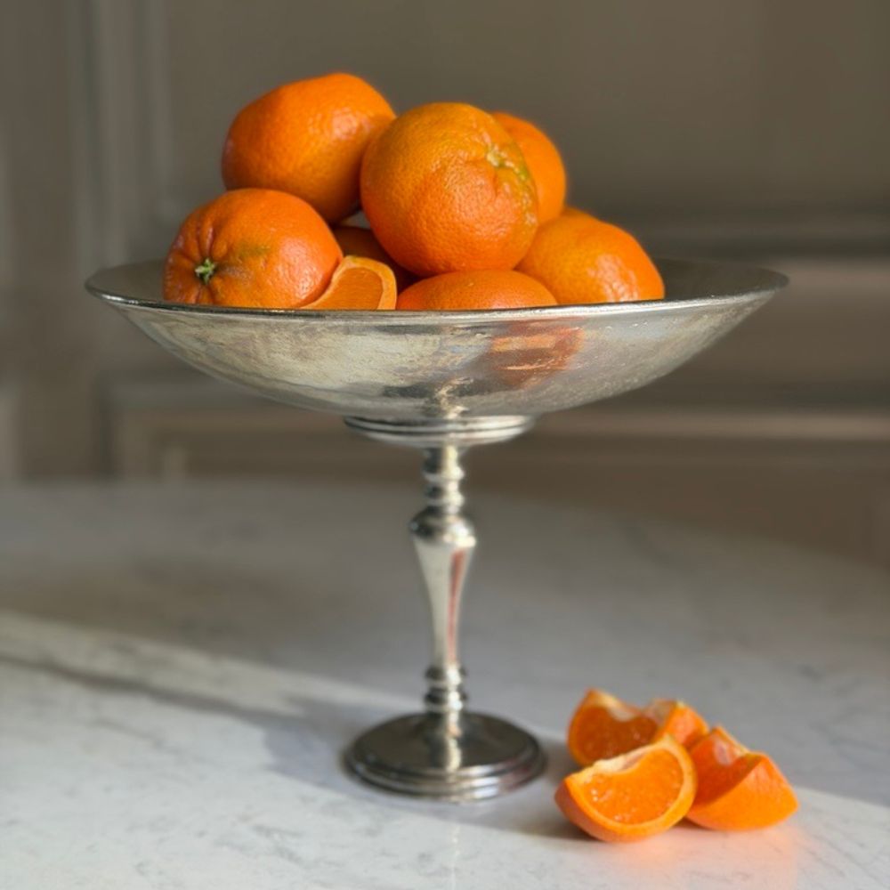 Arte Italica Peltro Pedestal Bowl side view — Italian pewter serveware filled with Mandarin Oranges