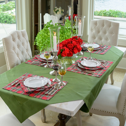 Table set with a evergreen table square and tartan red Italian cotton placemats and White Bella Bianca dishes
