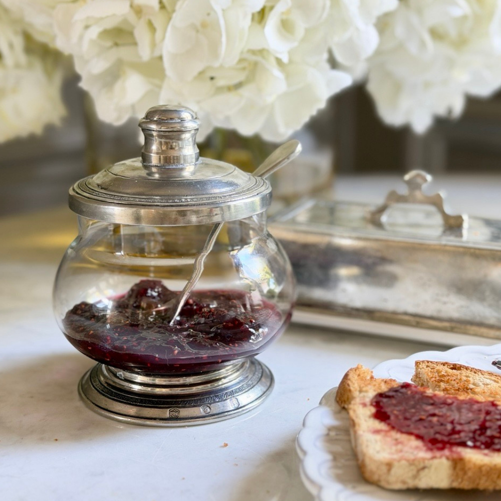 Tavola Covered glass Bowl with Pewter Lid and spoon on a table with toast and a Tuscan covered rectangular butter dish