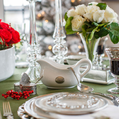 Tuscan Pewter Tab Gravy Boat on a table set with plates