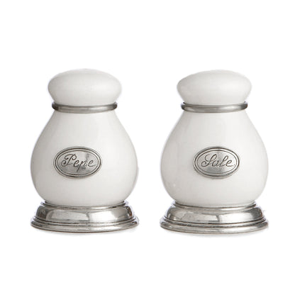 A pair of Tuscan salt and pepper shakers with white ceramic bodies and pewter accents, including silver-colored labels 'Pepe' and 'Sale' on each shaker.