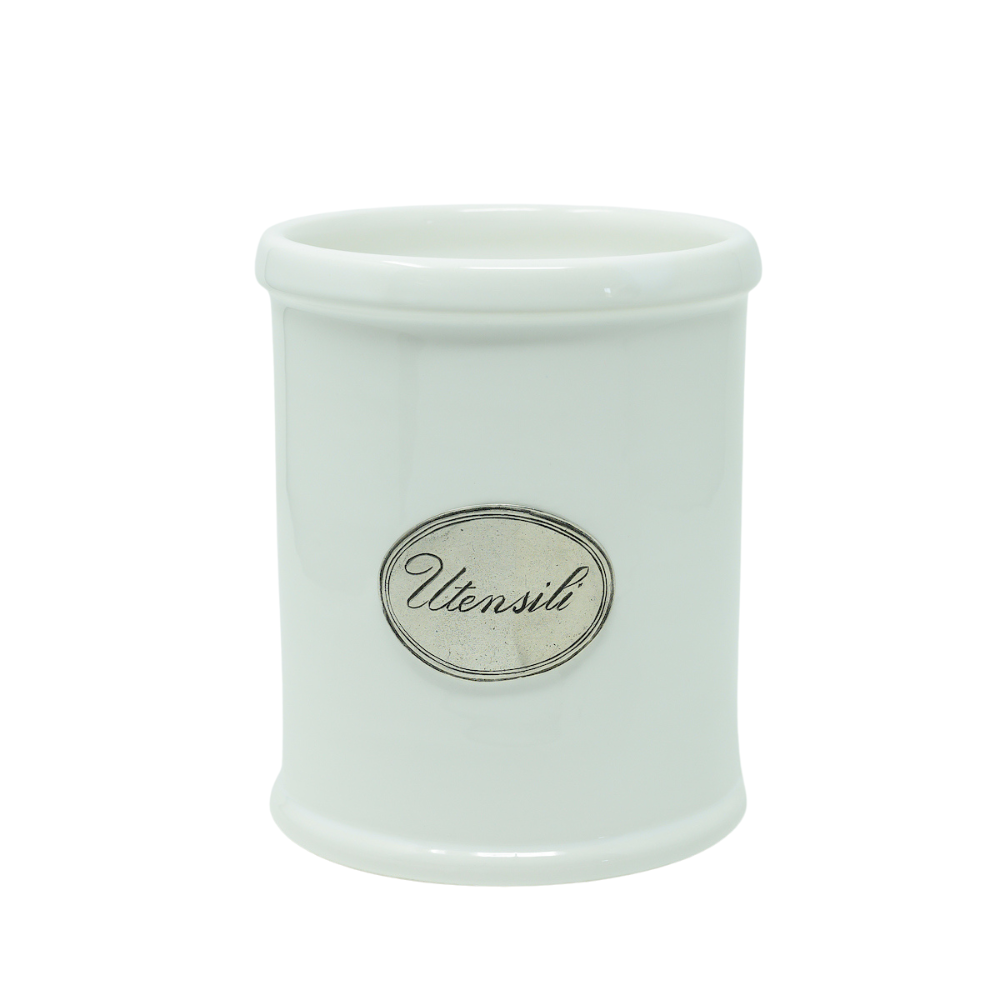 A white ceramic utensil holder with pewter trim and a label on the front that reads 'UTENSILI'.
