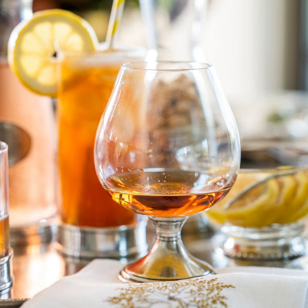 Arte Italica Verona Cognac Glass filled with cognac, styled for elegant entertaining