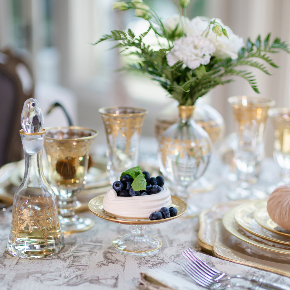 Vetro gold patisserie Dish on a table with pieces from the Vetro Gold collection