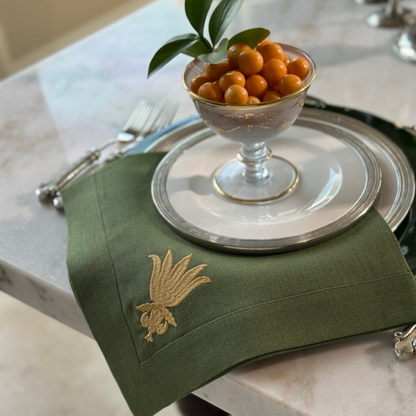 Evergreen 100% Linen napkin embroidered with Gold Villa Floret Design on Tuscan Dinnerware.