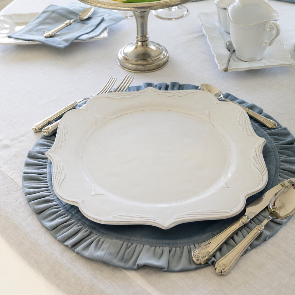 Arte Italica Bella Bianca filigree charger Italian stoneware angle view on placemat